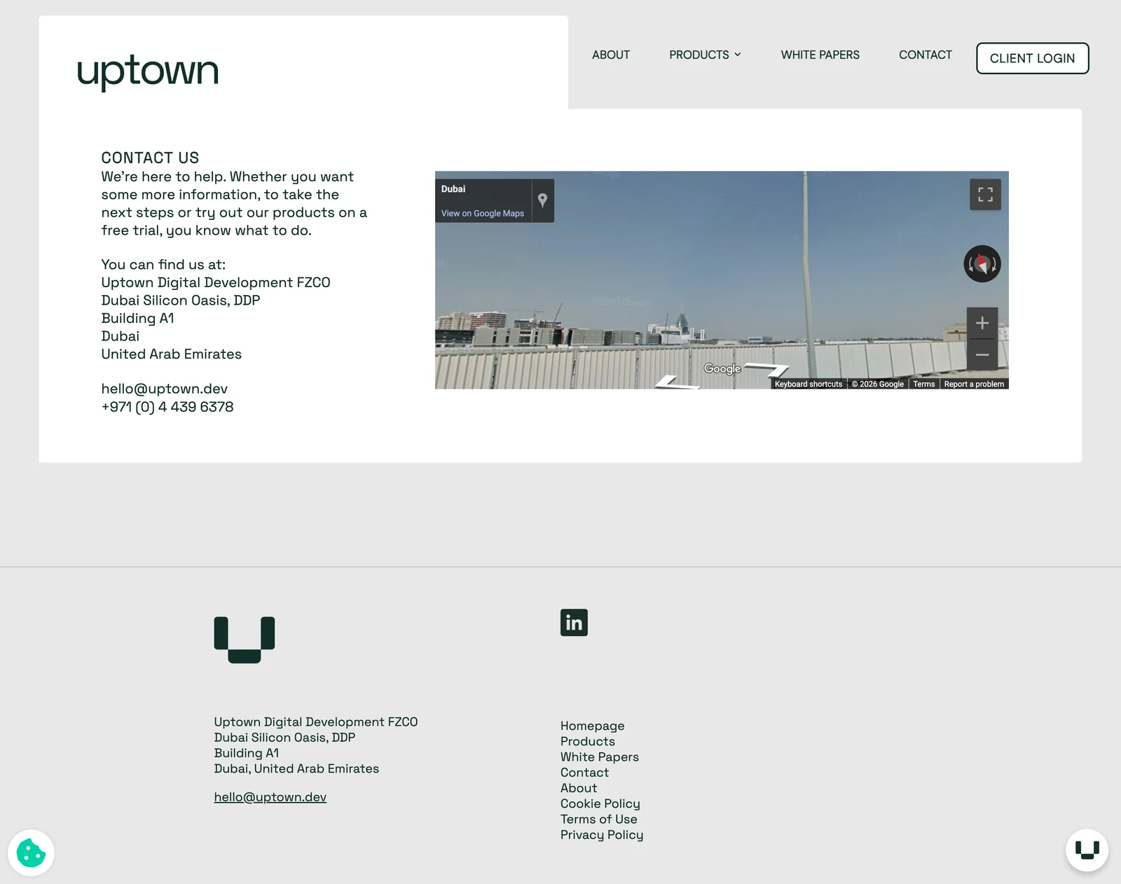 Uptown Contact page showing company contact information, a map and a compact footer.